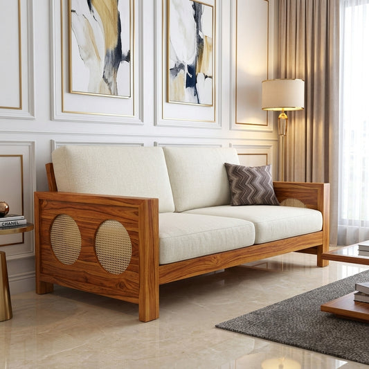 The RJ Art Sheesham Wood 2 Seater Sofa with Cane Panel Armrests and Cream Cushions